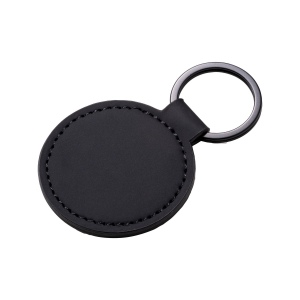 Porte-clés rond en PU souple. Avec anneau en métal