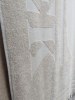 Serviette jacquard logo embossé relief éponge uni